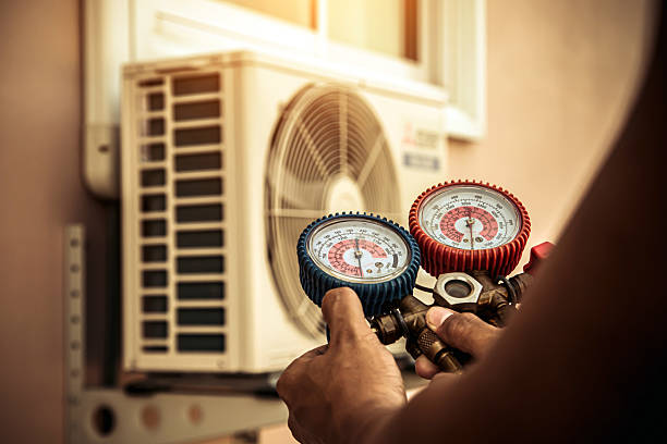 Professional Air Conditioning Service technician working in Willard, UT